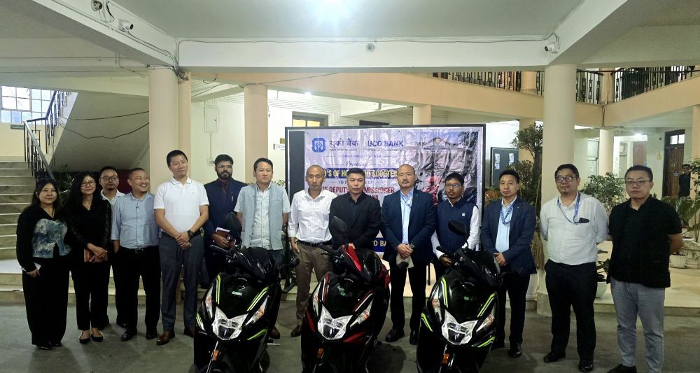 Officials of UCO Bank, Kohima Branch, hands over scooties to Deputy Commissioner Kohima B Henok Buchem at the DC Office, Kohima, on August 19.